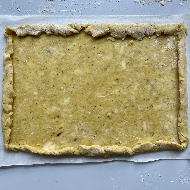 Image of Fold each of the sides in by half an inch and give it a gentle press to flatten.